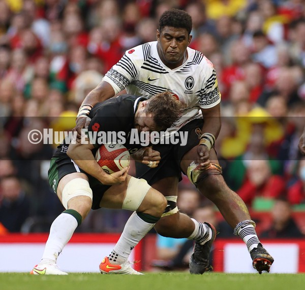 141121 - Wales v Fiji - Autumn Nations Series - Thomas Young of Wales is tackled by Temo Mayanavanua of Fiji