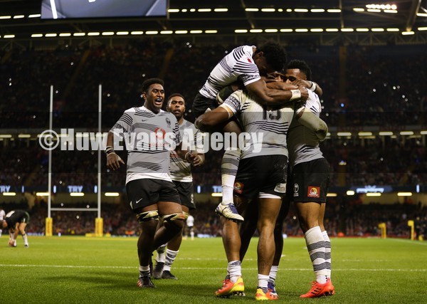 141121 - Wales v Fiji, Autumn Nations Series 2021 - Waisea Nayacalevu of Fiji celebrates with team mates after he dives in to score try