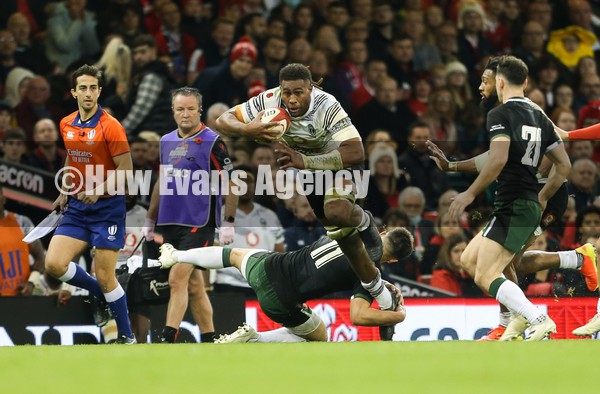 141121 - Wales v Fiji, Autumn Nations Series 2021 -  Viliame Mata of Fiji is tackled by Louis Rees-Zammit of Wales 