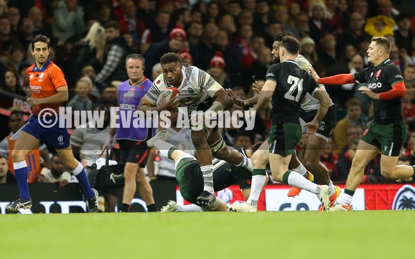 141121 - Wales v Fiji, Autumn Nations Series 2021 -  Viliame Mata of Fiji is tackled by Louis Rees-Zammit of Wales 