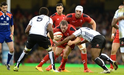 151114 - Wales v Fiji - Dove Men Series -Gethin Jenkins of Wales is tackled by Vereniki Goneva of Fiji