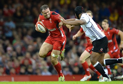 151114 - Wales v Fiji - Dove Men Series -Jamie Roberts of Wales gets past Akapusi Qera of Fiji