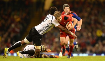 151114 - Wales v Fiji - Dove Men Series -Liam Williams of Wales takes on Leone Nakarawa of Fiji