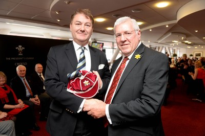 151114 - Wales v Fiji - Dove Men Series -Charles Raw-Rees receives a WRU president cap on behalf of Rheinallt Hugh Lloyd Davies from WRU President Dennis Gethin