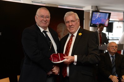 151114 - Wales v Fiji - Dove Men Series -Robin Williams receives a WRU president cap from WRU President Dennis Gethin