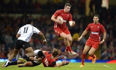 151114 - Wales v Fiji - Dove Men Series -Alex Cuthbert of Wales jumps over grounded players