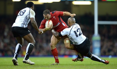 151114 - Wales v Fiji - Dove Men Series -Jamie Roberts of Wales is tackled by Nemani Nadalo of Fiji