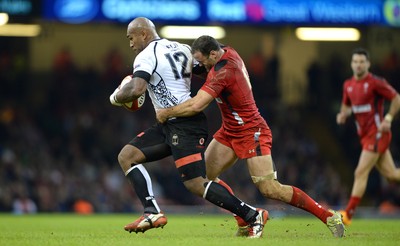 151114 - Wales v Fiji - Dove Men Series -Nemani Nadalo of Fiji is tackled by Jamie Roberts of Wales