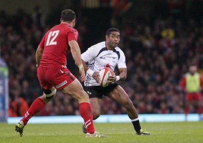 151114 - Wales v Fiji - Dove Men+Care Series - Asaeli Tikoirotuma of Fiji takes on Jamie Roberts of Wales