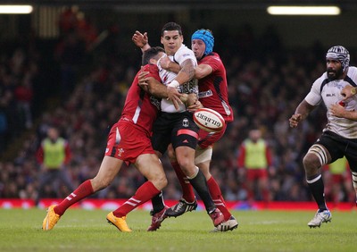 151114 - Wales v Fiji - Dove Men+Care Series - Josh Matavesi of Fiji is tackled by Mike Phillips and Justin Tipuric of Wales