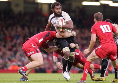 151114 - Wales v Fiji - Dove Men+Care Series - Api Ratuniyarawa of Fiji is tackled by Nicky Smith and Scott Baldwin of Wales