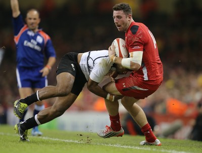 151114 -  Wales v Fiji, Dove Men Series 2014, Cardiff - Alex Cuthbert of Wales is tackled by Asaeli Tikoirotuma of Fiji 