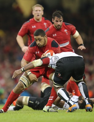 151114 -  Wales v Fiji, Dove Men Series 2014, Cardiff - Taulupe Faletau of Wales is tackled by Masi Matadigo of Fiji 