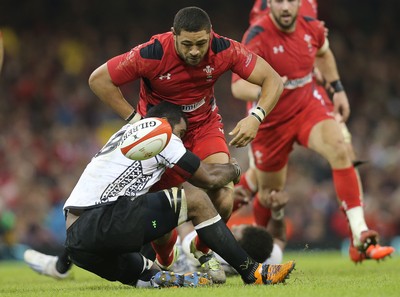 151114 -  Wales v Fiji, Dove Men Series 2014, Cardiff - Taulupe Faletau of Wales is tackled by Masi Matadigo of Fiji 