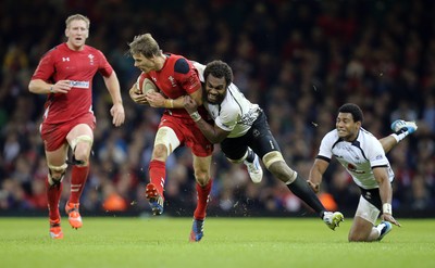 151114 -  Wales v Fiji, Dove Men Series 2014, Cardiff - Liam Williams of Wales  is tackled by Leone Nakarawa of Fiji 