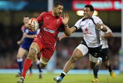 151114 -  Wales v Fiji, Dove Men Series 2014, Cardiff - Taulupe Faletau of Wales gets away from Waisea Nayacalevu of Fiji 