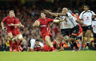 151114 -  Wales v Fiji, Dove Men Series 2014, Cardiff - Alex Cuthbert of Wales tries to break away from Nemani Nadalo of Fiji 