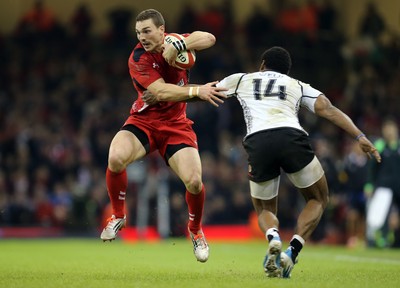 151114 -  Wales v Fiji, Dove Men Series 2014, Cardiff - George North of Wales cuts inside Waisea Nayacalevu of Fiji 