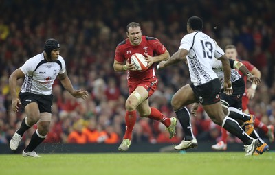 151114 -  Wales v Fiji, Dove Men Series 2014, Cardiff - Jamie Roberts of Wales takes on Vereniki Goneva of Fiji as he charges forward