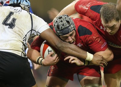 151114 -  Wales v Fiji, Dove Men Series 2014, Cardiff - Dan Lydiate and Gethin Jenkins of Wales are challenged by Tevita Cavubati of Fiji  