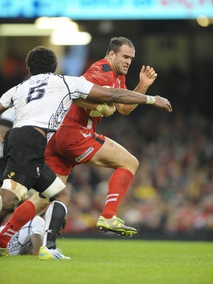 151114 - Wales v Fiji - Dove Men Series -Wales Jamie Roberts gets past Leone Nakarawa of Fiji(c) Huw Evans Agency