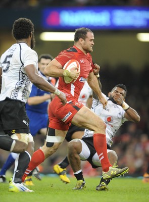 151114 - Wales v Fiji - Dove Men Series -Wales Jamie Roberts gets past Leone Nakarawa of Fiji(c) Huw Evans Agency