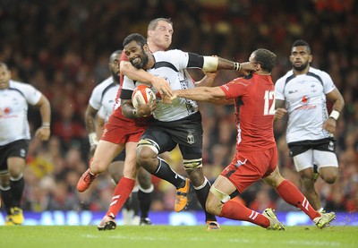 151114 - Wales v Fiji - Dove Men Series -Masi Matadigo of Fiji  is tackled by Gethin Jenkins and Jamie Roberts(c) Huw Evans Agency