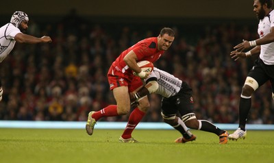 151114 - Wales v Fiji - Dove Men Series -Jamie Roberts of Wales slips through the Fijian defence (c) Huw Evans Picture Agency