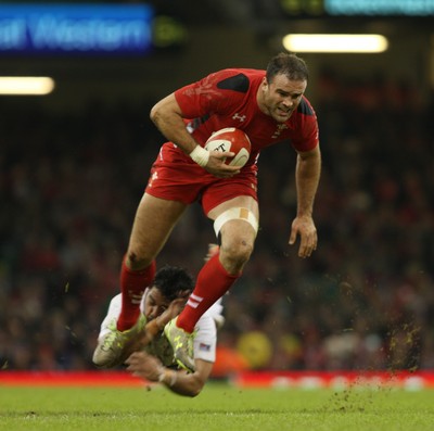 151114 - Wales v Fiji - Dove Men Series -Jamie Roberts of Wales slips the tackle of Campese Ma'afu of Fiji (c) Huw Evans Picture Agency