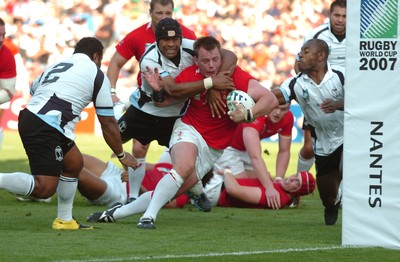 29.09.07 - Wales v Fiji - Rugby World Cup 2007 - Wales' Matthew Rees is tackled by Fiji's Akapusi Qera 