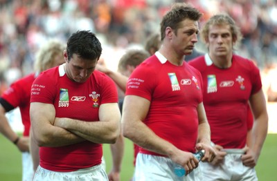 29.09.07 - Wales v Fiji - Rugby World Cup 2007 - Wales' (L-R) Stephen Jones, Ian Gough and Alun Wyn Jones looks dejected at the end of the game 