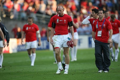29.09.07 Wales v Fiji... Wales' captain Gareth Thomas leaves the field dejected carrying the 100th celebratory cap. 