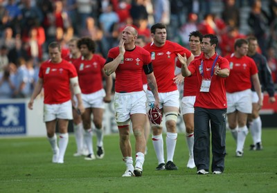 29.09.07 Wales v Fiji... Wales' captain Gareth Thomas leaves the field dejected carrying the 100th celebratory cap. 
