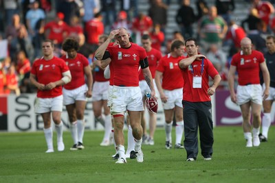 29.09.07 Wales v Fiji... Wales' captain Gareth Thomas leaves the field dejected carrying the 100th celebratory cap. 