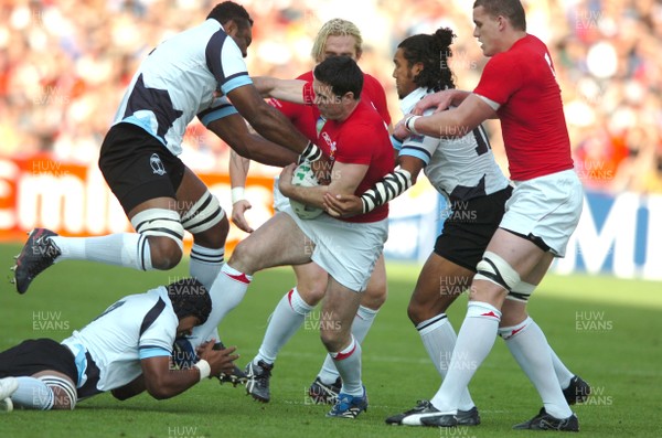 29.09.07 - Wales v Fiji - Rugby World Cup 2007 - Wales' Stephen Jones is tackled by the Fijian defence 