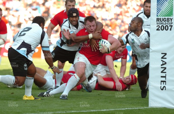 29.09.07 - Wales v Fiji - Rugby World Cup 2007 - Wales' Matthew Rees is tackled by Fiji's Akapusi Qera 