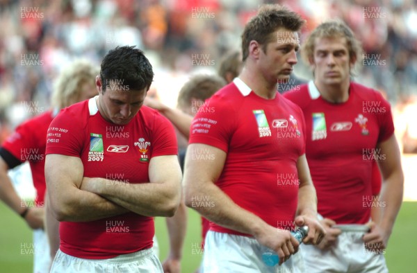 29.09.07 - Wales v Fiji - Rugby World Cup 2007 - Wales' (L-R) Stephen Jones, Ian Gough and Alun Wyn Jones looks dejected at the end of the game 