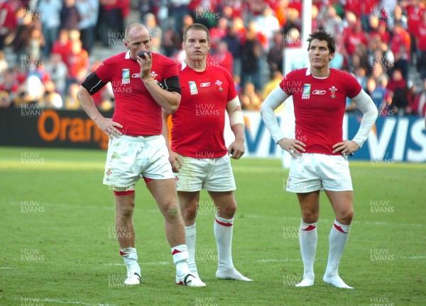 29.09.07 - Wales v Fiji - Rugby World Cup 2007 - Wales' (L-R) Gareth Thomas, Gethin Jenkins and James Hook looks dejected at the end of the game 