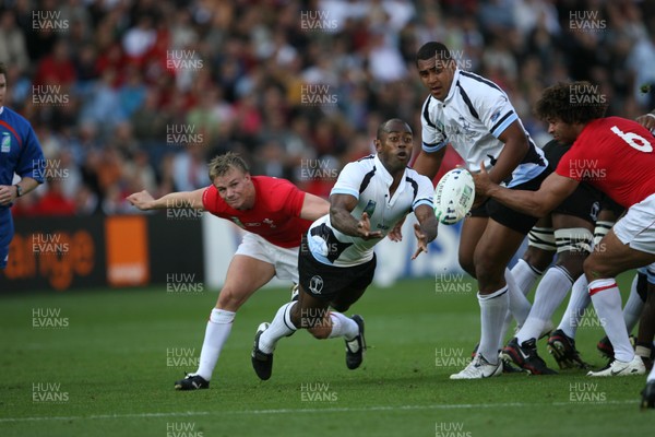 29.09.07 Wales v Fiji... Fiji's Mosese Rauluni gets ball away from Dwayne Peel 