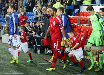 161113 - Wales vs Finland - International Friendly Ashley Williams leads out the Wales team(c) Huw Evans Agency