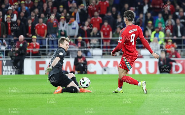210324 - Wales v Finland, Euro 2024 qualifying play-off semi-final - Brennan Johnson of Wales is denied by Finland goalkeeper Lukas Hradecky