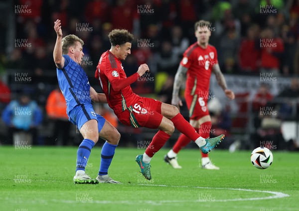 210324 - Wales v Finland, Euro 2024 qualifying play-off semi-final - Ethan Ampadu of Wales is tackled by Rasmus Schuller of Finland