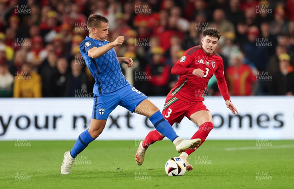 210324 - Wales v Finland, Euro 2024 qualifying play-off semi-final - Neco Williams of Wales is tackled by Robin Lod of Finland