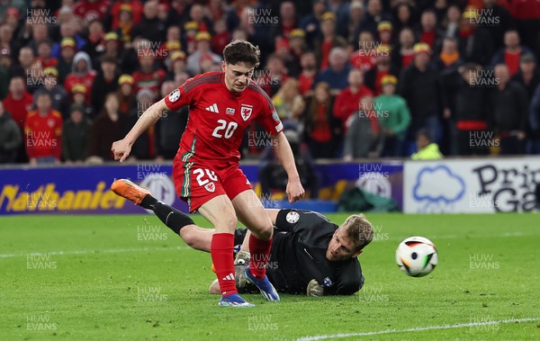210324 - Wales v Finland, Euro 2024 qualifying play-off semi-final - Finland goalkeeper Lukas Hradecky is beaten by Daniel James of Wales to score the fourth goal