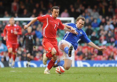 28.03.09 - Wales v Finland, FIFA World Cup 2010 Qualifying Group 4 -  Wales' Simon Davies is challenged by Finland's Markus Heikkinen 