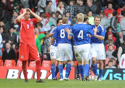 28.03.09 - Wales v Finland, FIFA World Cup 2010 Qualifying Group 4 -  Finland players celebrate after scoring their second goal as Wales' Chris Gunther looks dejected 