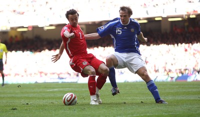 28.03.09 - Wales v Finland, FIFA World Cup 2010 Qualifying Group 4 -  Wales' Simon Davies Finland's Markus Heikkinen  