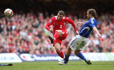 28.03.09 - Wales v Finland, FIFA World Cup 2010 Qualifying Group 4 -  Wales' Jason Koumas fires a shot at goal as Finland's Jonatan Johansson closes in 