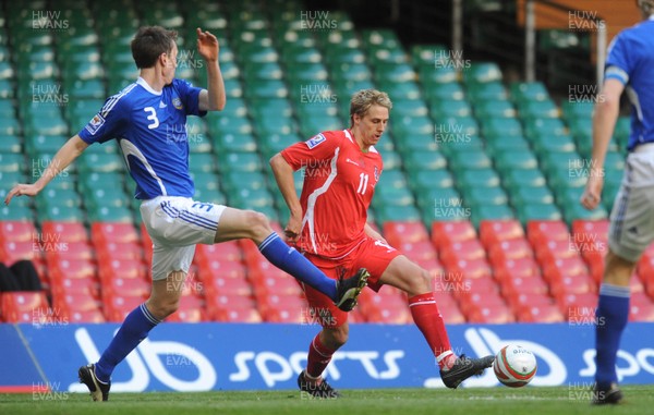28.03.09 - Wales v Finland, FIFA World Cup 2010 Qualifying Group 4 -  Wales' David Edwards is challenged by Finland's Toni Kallio 