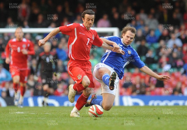 28.03.09 - Wales v Finland, FIFA World Cup 2010 Qualifying Group 4 -  Wales' Simon Davies is challenged by Finland's Markus Heikkinen 